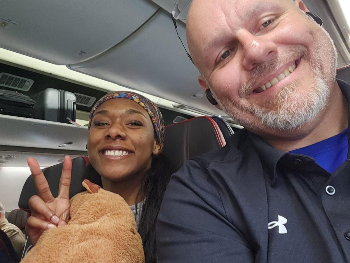 Samyra and her Coach Lance Brown on flight to North Dakota.